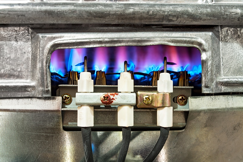 close-up of a pilot light on a furnace.